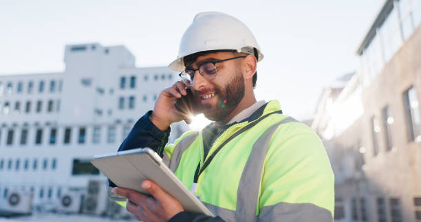 istock Phone call, tablet and construction engineer on site with communication for contract city talk. Digital technology, industry and civil worker man with blueprint planning for renovation approval 2171312880