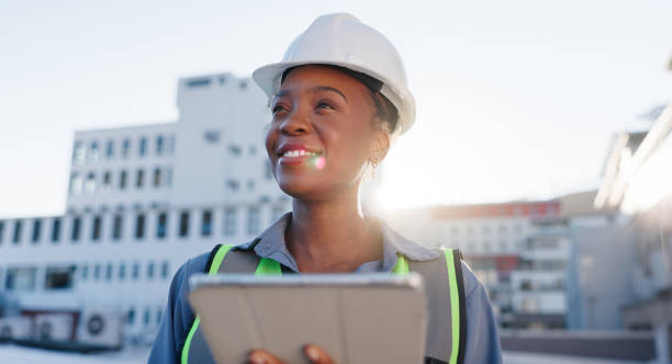 istock Engineer, thinking or tablet on rooftop for construction planning, building maintenance or vision. Black woman, smile or tech for project management in city for infrastructure development feedback 2171312891
