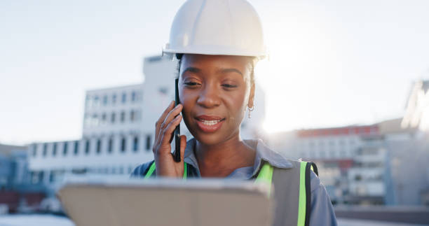 istock Tablet, phone call and construction engineer on site with communication for contract city planning. Technology, industry and black woman civil worker with mobile discussion for renovation approval 2171312913