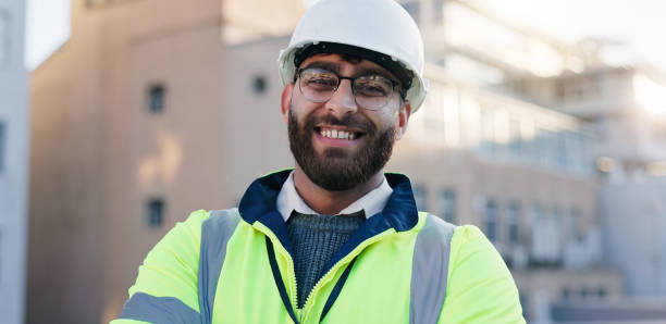 istock Construction worker, rooftop and man portrait with architecture and urban planning with success outdoor. Architect, civil engineering and smile in city with quality assurance work on site 2171312918