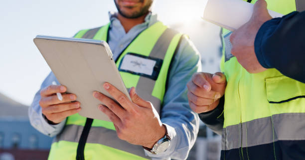 istock Business people, hands and tablet with blueprint for construction, planning or building maintenance in city. Closeup, employees or civil engineer with technology for architectural layout on rooftop 2171314777