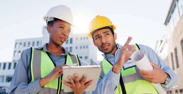 istock Tablet, blueprint and construction team on rooftop site for city planning, renovation or building project. Digital technology, architecture and industrial employees with maintenance check in town. 2171314781