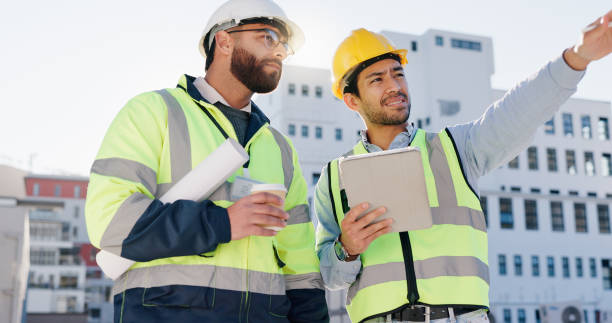 istock Businessmen, architect and planning construction with tablet for building maintenance or implementation in city. Man, contractor or civil engineer with colleague or technology for architecture ideas 2171314785