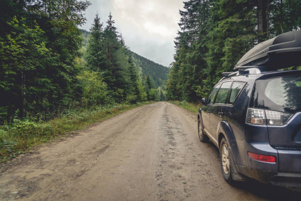 car for traveling with a mountain road. Blue sky