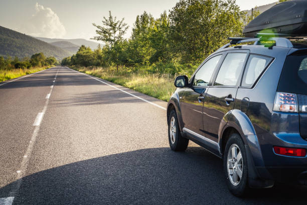istock car for traveling with a mountain road 2171315519