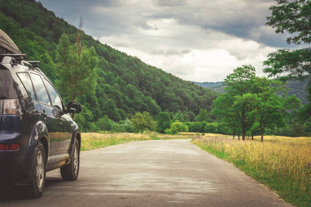 istock car for traveling with a mountain road 2171315723
