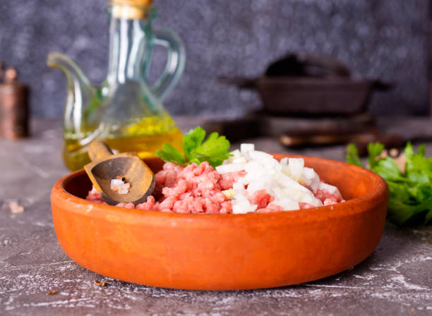 istock Fresh Raw Beef Minced Meat with herbs and onion 2171317407