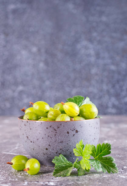 istock Fresh gooseberry in gray bowl on a table 2171317439