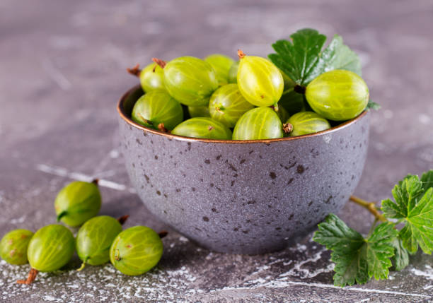istock Fresh gooseberry in gray bowl on a table 2171317456