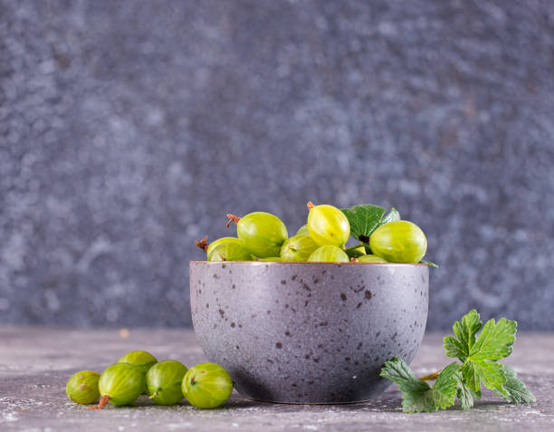 istock Fresh gooseberry in gray bowl on a table 2171317471