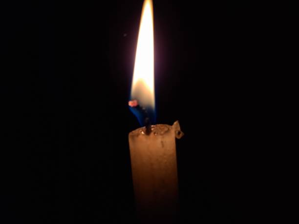 istock The candle : A candle in the night casts a soft, warm glow, creating a tranquil ambiance. Its flickering flame illuminates the darkness, adding a cozy, intimate touch to any evening setting. 2171317686
