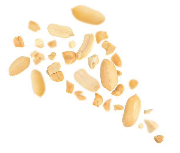 istock Peeled Peanuts levitating in air Isolated.  Falling crushed peanuts on white. Peanut explosion.  Package design element  2171319186