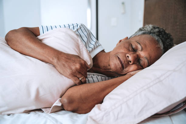 istock senior woman sleeping 2171320889