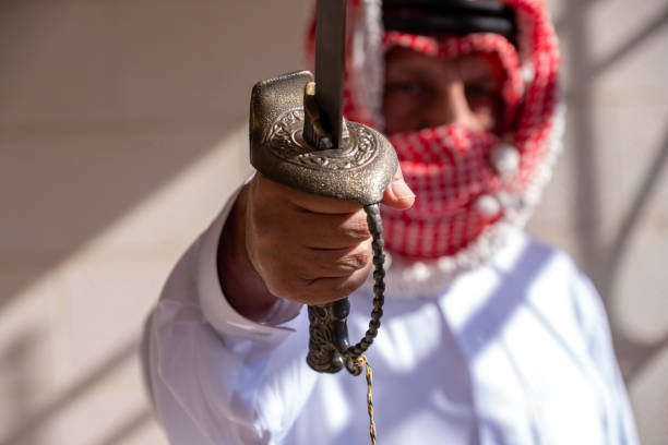 istock Arabic male holding sword under the sun 2171321627