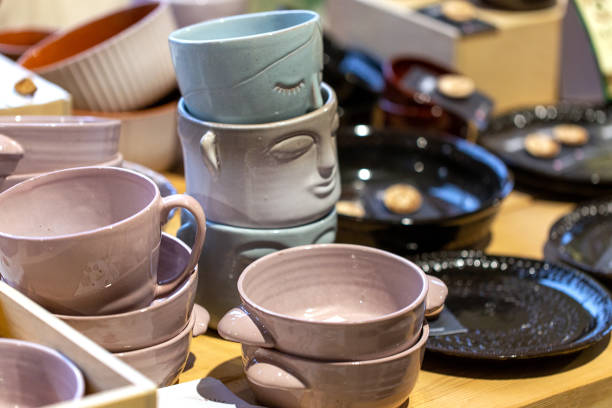 istock Various ceramic mugs and plates at a street market 2171322003