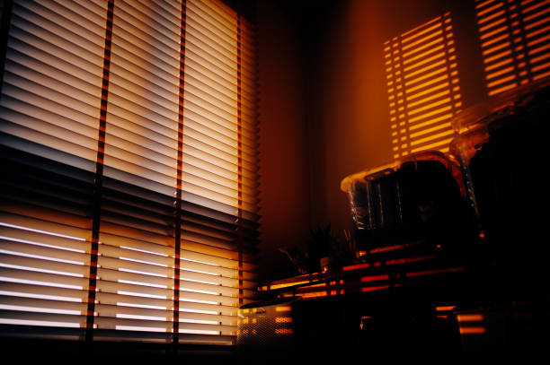 istock in silhouette sunset warm light through window in domestic room 2171322739