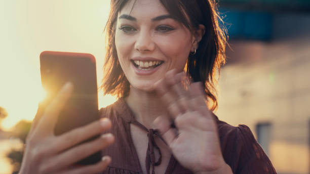 istock Young woman using smart phone for video call 2171324466