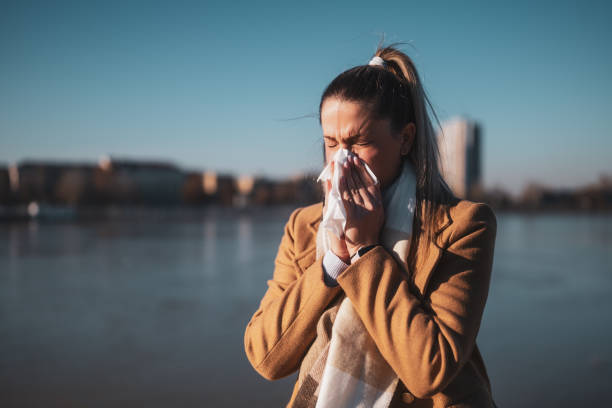 istock Woman blowing nose 2171324627