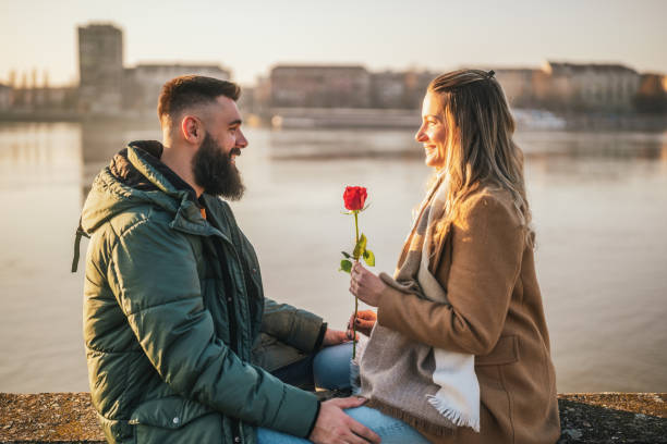 istock Man giving rose to his woman 2171324698