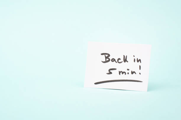 istock Back in 5 min is standing on a paper, message, working break, be right back 2171327309