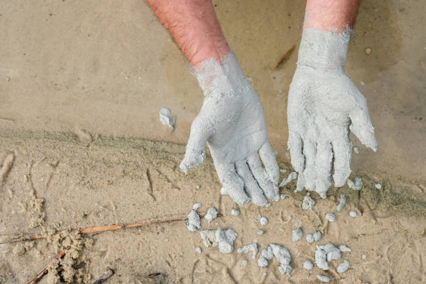 istock Hands palms up. Blue clay on the man's hands. 2171328891