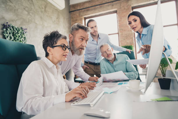 istock Photo of teamwork people together working networking computer comfortable modern office loft room interior indoors workspace 2171332714