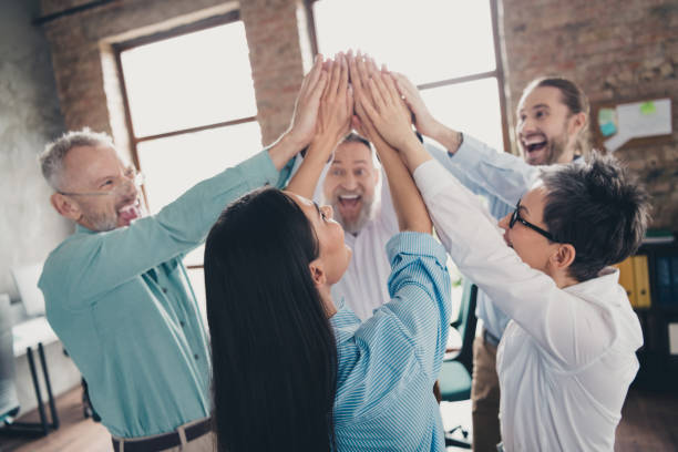 istock Photo of coworking project teamwork people highfive teambuilding work together conference meeting successful nice light office 2171332749