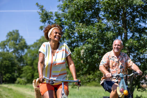 Peddling Through Life’s Beautiful Moments Medium shot of a husband and wife cycling along a country dirt track in Castelferrus near Toulouse - France. They are cycling towards the camera on their morning routine after buying fresh bread and groceries. They are both smiling and enjoying life.
Videos are available similar to this scenario. man 60s bicycle stock pictures, royalty-free photos & images
