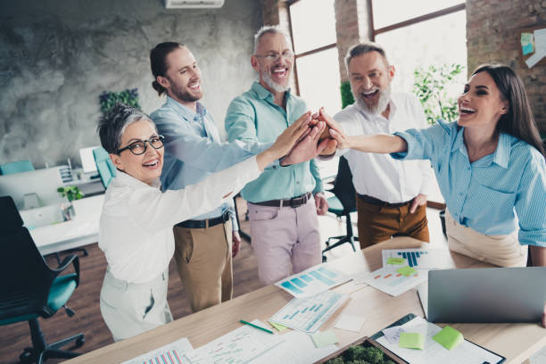 istock Photo of teamwork people working together  highfive hold hands support comfortable modern office loft room interior indoors workspace 2171332948