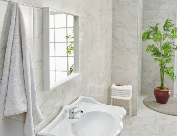 istock Bathroom white ceramic sink and stand style, mirror view with board and washing machine. 2171334654