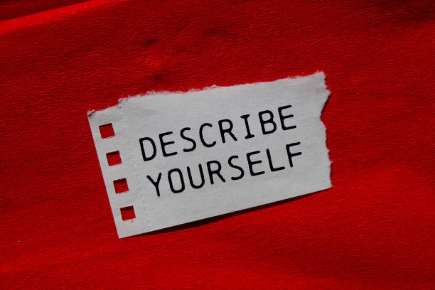 istock Describe yourself message written on ripped torn paper piece on red background 2171337518