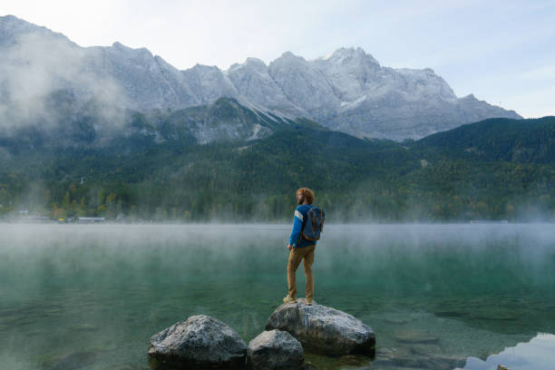 istock Man on Eibsee lake in Germany in autumn 2171339555