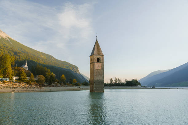 Sunken bell tower  in lake Resia,  Curon, Italy in autumn