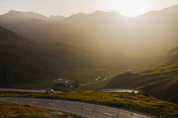 istock Car on scenic road through Alps at sunset 2171341225