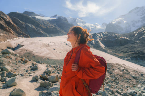 Woman exploring glacier in Swiss Alps