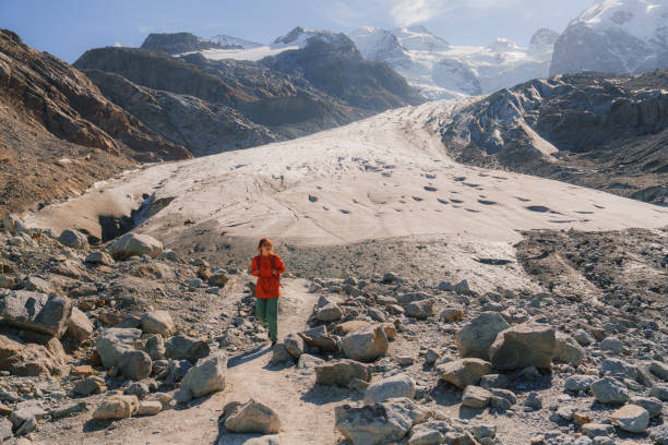 istock Woman exploring glacier in Swiss Alps 2171341238
