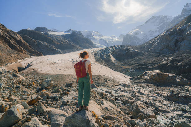 istock Woman exploring glacier in Swiss Alps 2171341270