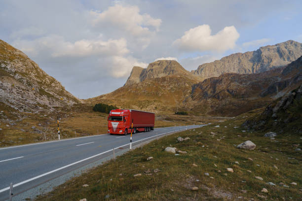 istock Cargo container truck  on road through Alps in autumn 2171341364