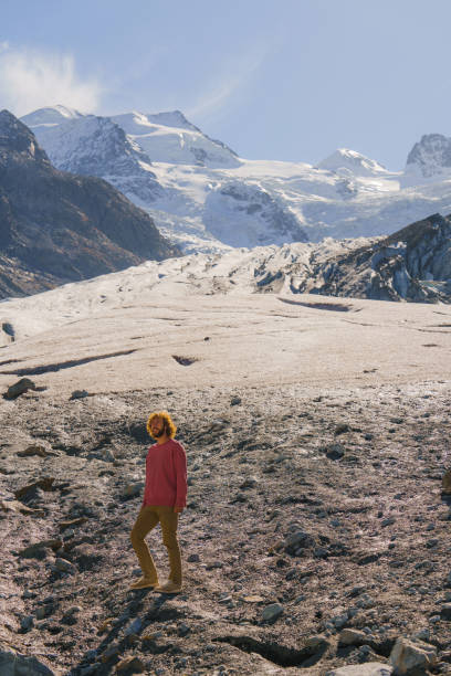 istock Man walking on Morteratsch Glacier in Swiss Alps 2171341454