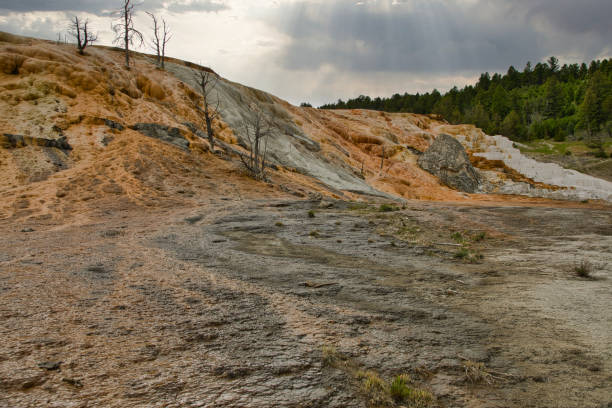 istock Mammoth, Hot Spring Terraces, Orange Spring Mound in Yellowstone National Park with beautiful landscape. Sinter terraces and hot springs. The smell, the colors, the sounds are a natural experience. 2171341681
