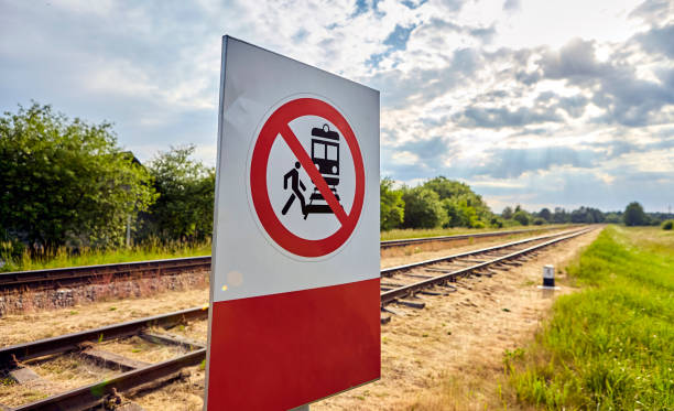 istock Warning Sign Prohibiting Access to Railway Tracks Under the Bright Sunlight 2171343474