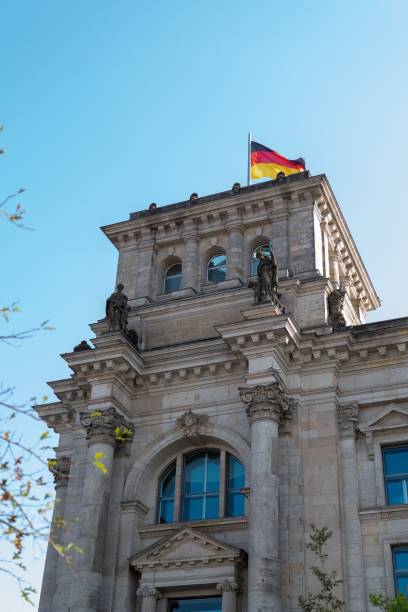 istock Reichstag building with German flag in Berlin 2171346300