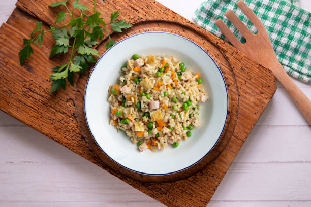 istock Brown rice with vegetables and turkey cubes. Top view table. 2171346837