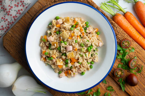 istock Brown rice with vegetables and turkey cubes. Top view table. 2171346873