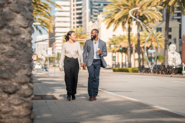 istock Professionals in Partnership Strolling San Diego Streets 2171347923