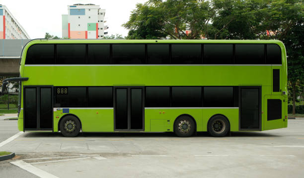 Blank double decker bus for advertising mock up wrap display. Out of home OOH advertising on public transportation. Green bus. No people Blank double decker bus for advertising mock up wrap display. Out of home OOH advertising on public transportation. Green bus. No people. double decker bus stock pictures, royalty-free photos & images