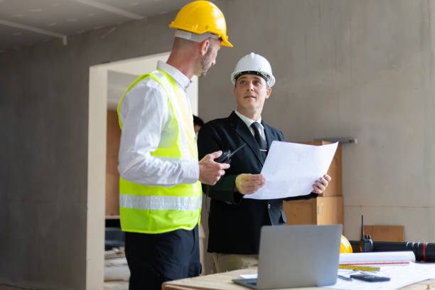 istock Businessman, contractors and engineers working at construction sites are construction inspector and supervise the work according to plans. Coworker cooperation and teamwork to ensure workplace safety. 2171349281