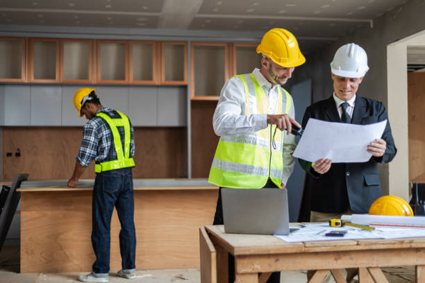 istock Businessman, contractors and engineers working at construction sites are construction inspector and supervise the work according to plans. Coworker cooperation and teamwork to ensure workplace safety. 2171349290