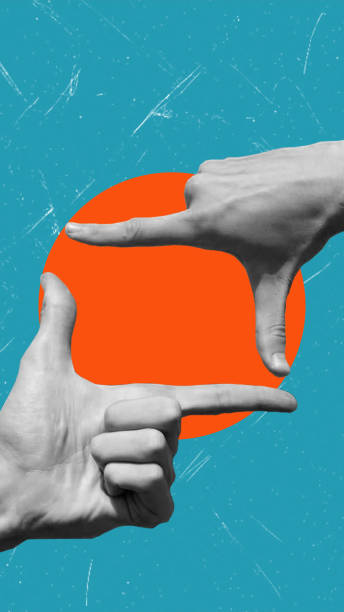 istock Creative hands framing a vibrant orange circle against a textured blue backdrop expressing artistic vision 2171349496