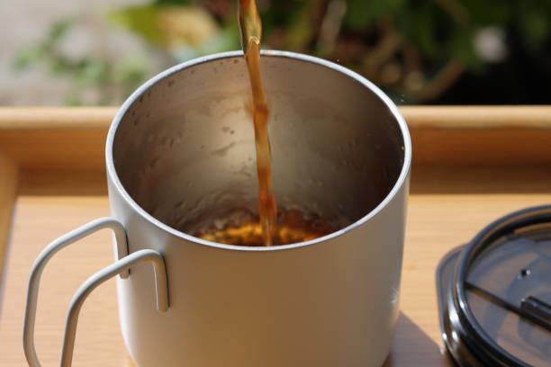 istock Pouring tea in cup. Healthy hot drink. Black tea drink 2171350280